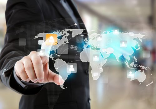 Social Network concept : Business man point to social network a Social Network concept : Business man point to social network and world map